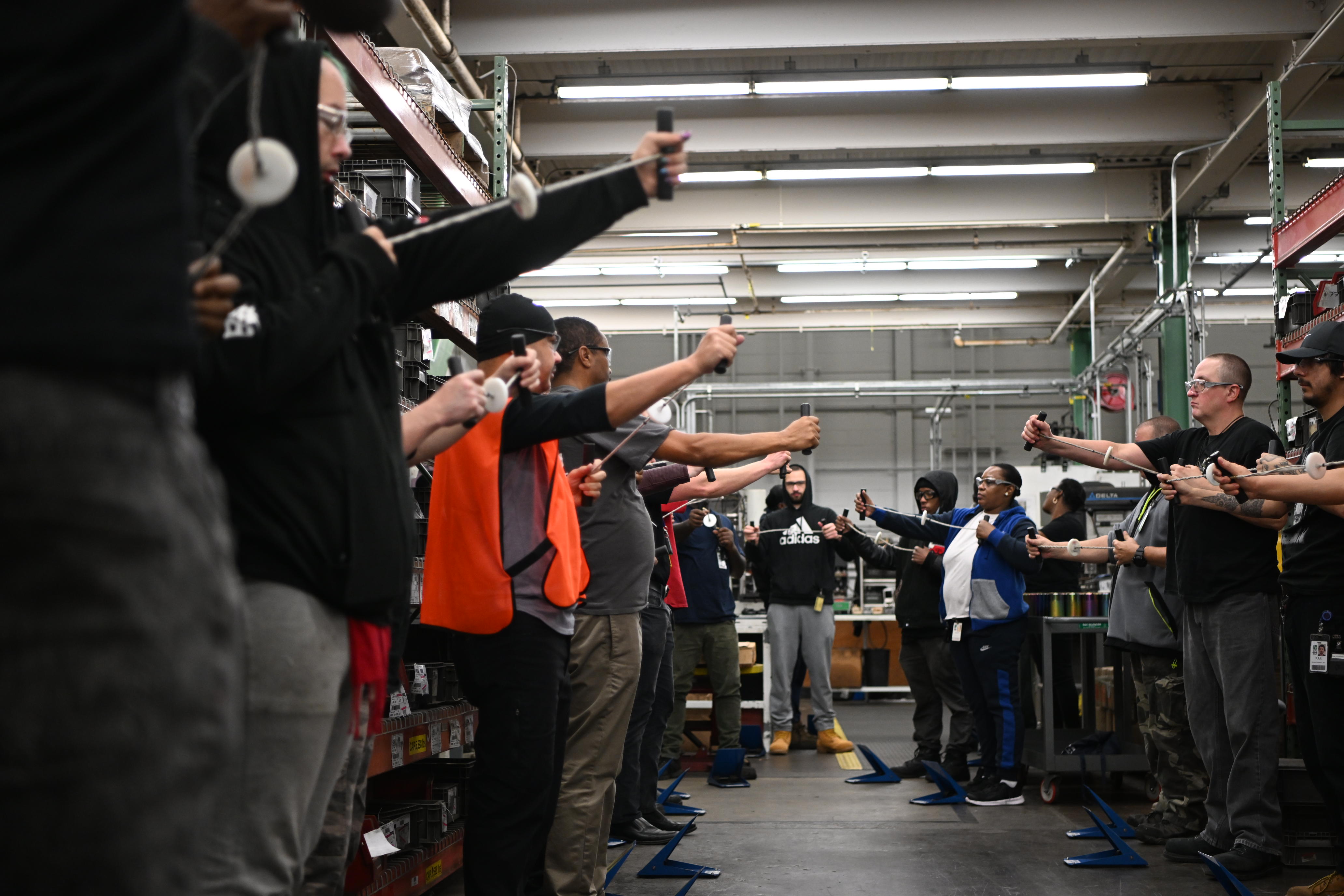 S&C team members doing ergonomic warm-ups 