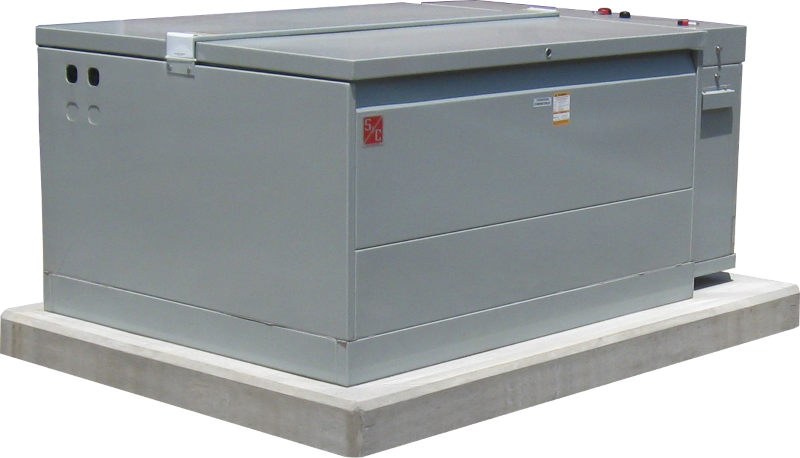 Corner view of a Remote-Supervisory Vista&reg; Underground Distribution Switchgear unit. It is a muted gray-green color with a red S&C logo on its front. The unit is closed and sits neatly on a concrete pad.